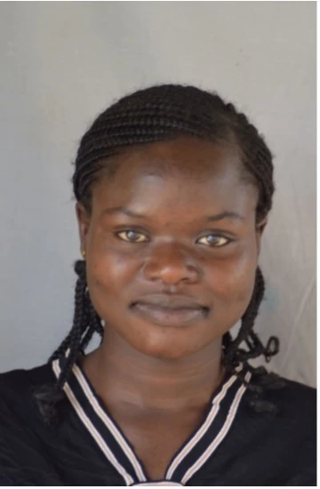 A teacher interacting with children in a classroom